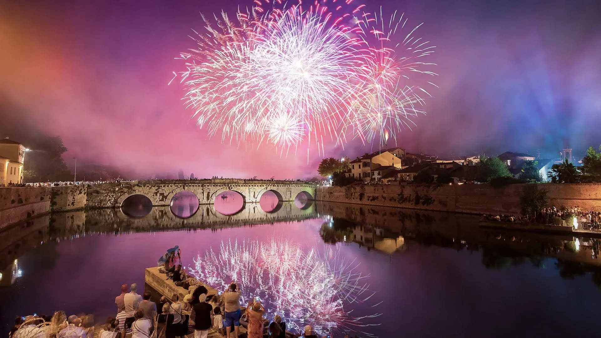 Fireworks over the Tiberius Bridge seen from Borgo San Giuliano, Rimini